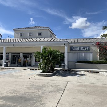Shell - the front of a building with a palm tree in front of it - Gas Stations Near Me - Miami, Florida