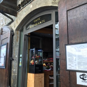 Oinos - Side door opening to the outside patio area overlooking the street - Pizza Near Me - Florence, FI
