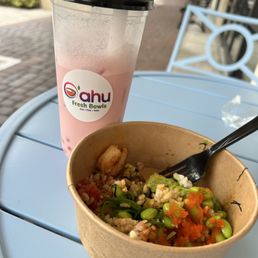 Dragon fruit boba with more then half eaten poke bowl.