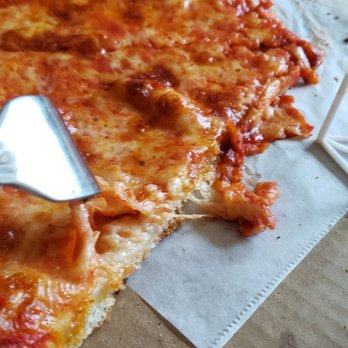 Napoli's Pizzeria - This shows the amount of topping on a cheese pizza! Almost none! - Pizza Near Me - Malta, New York Napoli's Pizzeria - This shows the amount of topping on a cheese pizza! Almost none! - Pizza Near Me - Malta, New York