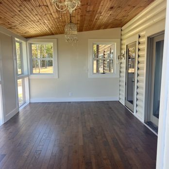 J and Son Builder - Finished sunroom with new hardwood floors, cedar plank ceiling; light fixtures; drywall, paint, and trim. - General Contractors Near Me J and Son Builder - Finished sunroom with new hardwood floors, cedar plank ceiling; light fixtures; drywall, paint, and trim. - General Contractors Near Me