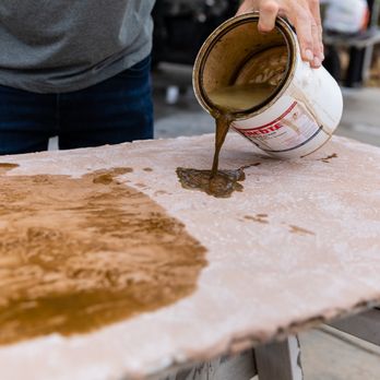Infinite Concrete Designs - a man pouring cement onto a table - Masonry/Concrete Near Me - Spring Branch, Texas