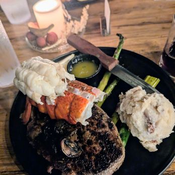 Campfire - 14 oz ribeye with butter poached lobster tail - Burgers Near Me - Helen, Georgia Campfire - 14 oz ribeye with butter poached lobster tail - Burgers Near Me - Helen, Georgia