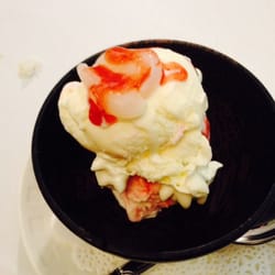 Strawberry Sundae icecream with whipped cream and lychee.