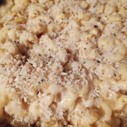 Freshly baked tray of mac and cheese at home with panko bread crumbs. Freshly baked tray of mac and cheese at home with panko bread crumbs.
