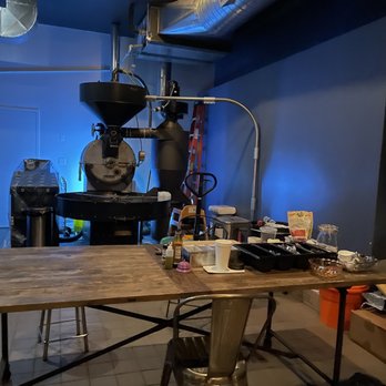 Coffee Mob Bar & Roastery - a man working in the background - Wine Bars Near Me - Brooklyn, New York