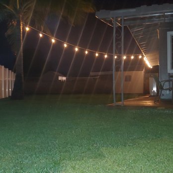 Aloha Ainascape - a patio with string lights - Landscaping Near Me