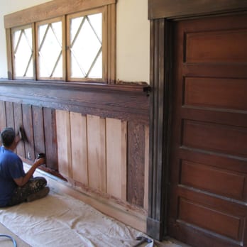 Riverside Restorative - a man working on a wood paneled wall - General Contractors Near Me Riverside Restorative - a man working on a wood paneled wall - General Contractors Near Me