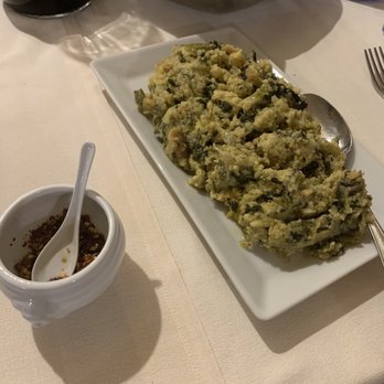 Olmicello - A rustic version of polenta, filled with chickory, broccoli rabe, beet leaf, and infused with delicious olive oil. - Italian Near Me - Oratino, CB