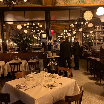 Le Gratin - a dining room with tables and chairs - French Near Me - New York, New York