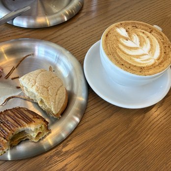 Little While - Latte and two of the pastries half eaten - Coffee & Tea Near Me - San Diego, California Little While - Latte and two of the pastries half eaten - Coffee & Tea Near Me - San Diego, California