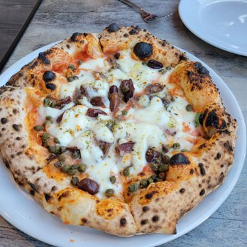 Bottega Italia - The puteseca, capers, anchovies and kalamata olives. - Pizza Near Me - Temecula, California Bottega Italia - The puteseca, capers, anchovies and kalamata olives. - Pizza Near Me - Temecula, California