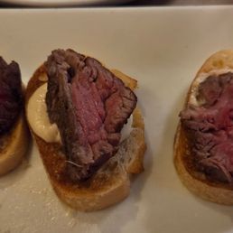 Filet Mignon Crostini ordered med well. The first piece is actually raw and the others are rare to med rare Filet Mignon Crostini ordered med well. The first piece is actually raw and the others are rare to med rare