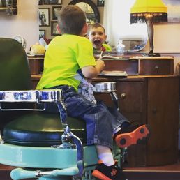 Ronan making faces in the mirror.