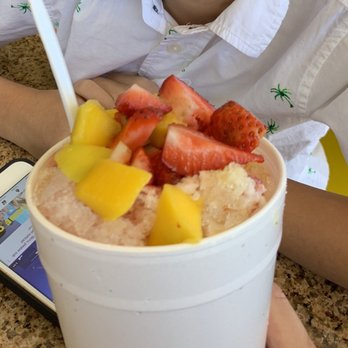 Paradise Smoothie - a woman sitting at a table with a cell phone - Juice Bars & Smoothies Near Me - Baton Rouge, Louisiana Paradise Smoothie - a woman sitting at a table with a cell phone - Juice Bars & Smoothies Near Me - Baton Rouge, Louisiana