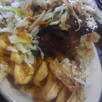 Paseo Catracho - Pollo ceibeno. Fried green bananas(not to be confused w/ green plantains)deep fried chicken breast & wing.Cabbage salad, cheese & red sauce - Latin American Near Me - Miami, Florida