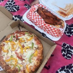 Pizza with bell peppers and buffalo wings Pizza with bell peppers and buffalo wings