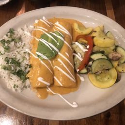 Grilled shrimp enchiladas with lobster sauce.