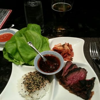 AnQi Bistro - Kalbi Hanger Steak Lettuce Wrap - kimchi with roasted onions and ginger scallion sauce. - Asian Fusion Near Me - Costa Mesa, California