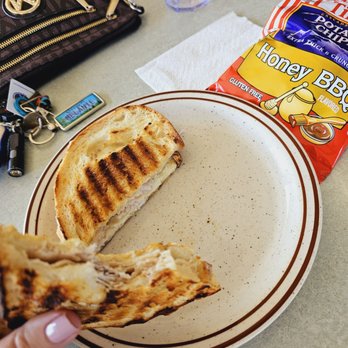 Stark Street Espresso Bar - a hand holding a grilled sandwich - Coffee & Tea Near Me - Troutdale, Oregon Stark Street Espresso Bar - a hand holding a grilled sandwich - Coffee & Tea Near Me - Troutdale, Oregon