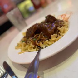 Junior's Restaurant - HUNGARIAN BEEF GOULASH Egg Noodles With Green Peas