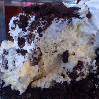 Black Pelican - Roasted Banana Cream Pie w/ Oreo Crust (after cutting it in half and messing it up a little) - Seafood Near Me - Kitty Hawk, North Carolina Black Pelican - Roasted Banana Cream Pie w/ Oreo Crust (after cutting it in half and messing it up a little) - Seafood Near Me - Kitty Hawk, North Carolina