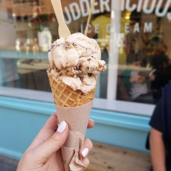 Udderlicious - chocolate peanut butter in large cone with two regular scoops - Ice Cream & Frozen Yogurt Near Me - London, XGL Udderlicious - chocolate peanut butter in large cone with two regular scoops - Ice Cream & Frozen Yogurt Near Me - London, XGL