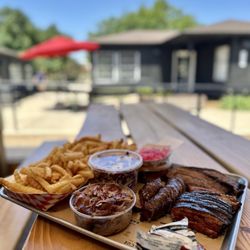 Smoke Queen Barbecue - 4 Meat 4 Sides: Pulled Pork, Sausage, Brisket, Char Siu. Double Tallow Fries, Sesame Slaw, Spicy Cucumbers.