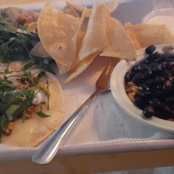 Hightide Burrito & Bar - Smoked chicken house tacos, chips and queso, with black beans and rice. - Mexican Near Me - Jacksonville, Florida Hightide Burrito & Bar - Smoked chicken house tacos, chips and queso, with black beans and rice. - Mexican Near Me - Jacksonville, Florida