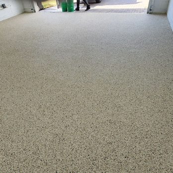 GarageExperts of Brevard - a man cleaning a garage floor - Flooring Near Me - Melbourne, Florida GarageExperts of Brevard - a man cleaning a garage floor - Flooring Near Me - Melbourne, Florida