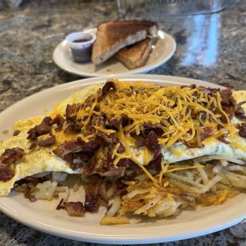 Sunny's Diner Nyberg - 6 Egg Omlette with bacon and cheddar on hash browns. - Breakfast & Brunch Near Me - Tualatin, Oregon Sunny's Diner Nyberg - 6 Egg Omlette with bacon and cheddar on hash browns. - Breakfast & Brunch Near Me - Tualatin, Oregon