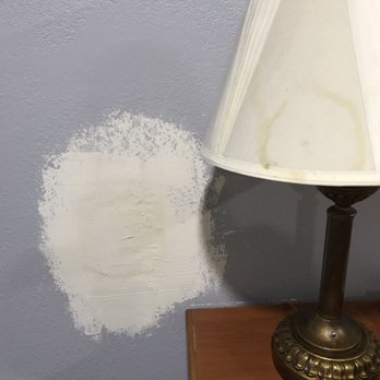 Motel 6 - Horribly patched hole in the wall and an old stained lamp.  First things we saw when we opened the door. - Hotels Near Me - Ukiah, California
