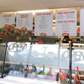 Poke Bros - a man behind the counter of a restaurant - Poke Near Me - Columbia, South Carolina Poke Bros - a man behind the counter of a restaurant - Poke Near Me - Columbia, South Carolina