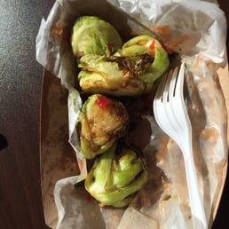 Oversized Brussel sprouts with a teeniny spoon. Oversized Brussel sprouts with a teeniny spoon.