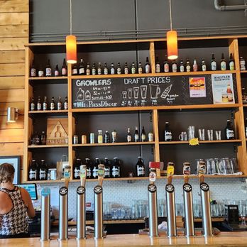 Whistler Brewing - a man and a woman at the bar - Breweries Near Me - Whistler, British Columbia Whistler Brewing - a man and a woman at the bar - Breweries Near Me - Whistler, British Columbia