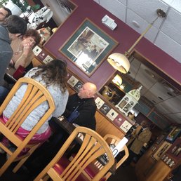 people sitting at tables people sitting at tables