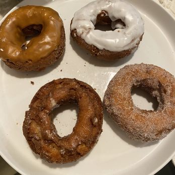 Boa Vista Orchards - Apple donuts: Top row-caramel, vanilla. Bottom row-glazed and powdered - Fruits & Veggies Near Me - Placerville, California Boa Vista Orchards - Apple donuts: Top row-caramel, vanilla. Bottom row-glazed and powdered - Fruits & Veggies Near Me - Placerville, California