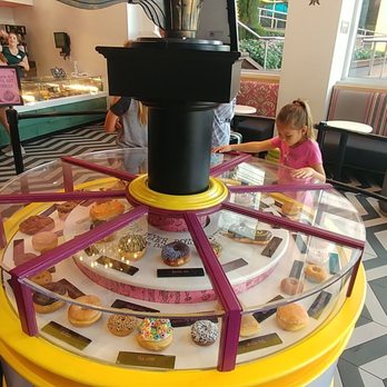 Voodoo Doughnut - Love rotating donut display - Bakeries Near Me - Orlando, Florida Voodoo Doughnut - Love rotating donut display - Bakeries Near Me - Orlando, Florida