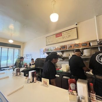 Snug Harbor - Action behind the counter. - Diners Near Me - Santa Monica, California Snug Harbor - Action behind the counter. - Diners Near Me - Santa Monica, California