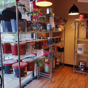 Carolina Popcorn Shoppe - Display shelf with popcorn tins. - Popcorn Shops Near Me - Raleigh, North Carolina