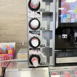 7-Eleven - Drink cups, lids and straws all conveniently located with prices clearly marked.