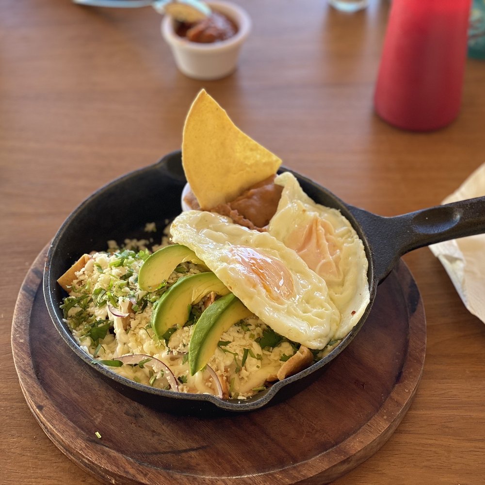 La Playa - Chilaquiles with half poblano cream and half chipotle cream sauce. THE BEST Chilaquiles I've ever had!! - Tiki Bars Near Me - Los Barriles, BCS