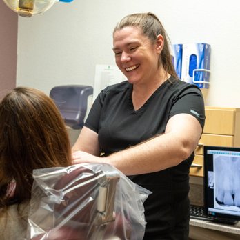 Watauga Dental Center - Dental assistant preparing a patient for their visit at Watauga Dental Center - General Dentistry Near Me - Watauga, Texas Watauga Dental Center - Dental assistant preparing a patient for their visit at Watauga Dental Center - General Dentistry Near Me - Watauga, Texas