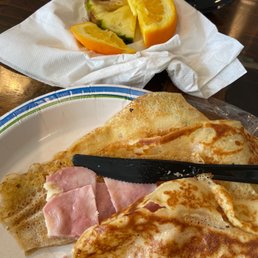 Rotting fruit (garnish so unnecessary) and ham and cheese crepe. Rotting fruit (garnish so unnecessary) and ham and cheese crepe.