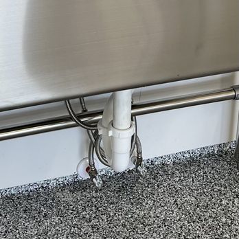 Prime Plumbing - Close up of utility drain pipe, water supply hoses and water shut off valves. - Plumbing Near Me - Caldwell, Idaho Prime Plumbing - Close up of utility drain pipe, water supply hoses and water shut off valves. - Plumbing Near Me - Caldwell, Idaho