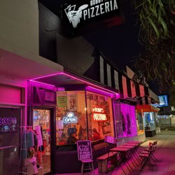 Bobby’s Pizzeria - Outside walking on street. Seating outside.