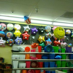 Dollar Tree - They sell helium balloons and quite a large selection.