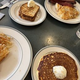 Pancakes, hash browns, toast and bacon Pancakes, hash browns, toast and bacon