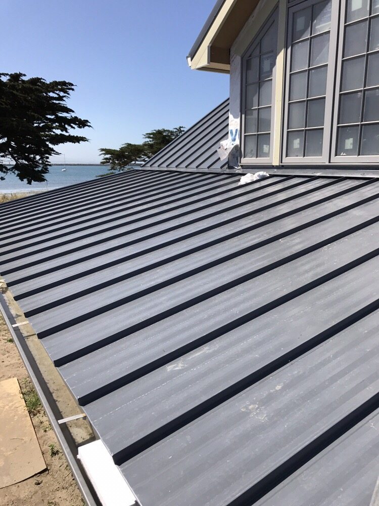 Slide of Caruzo's Roofing Contractors