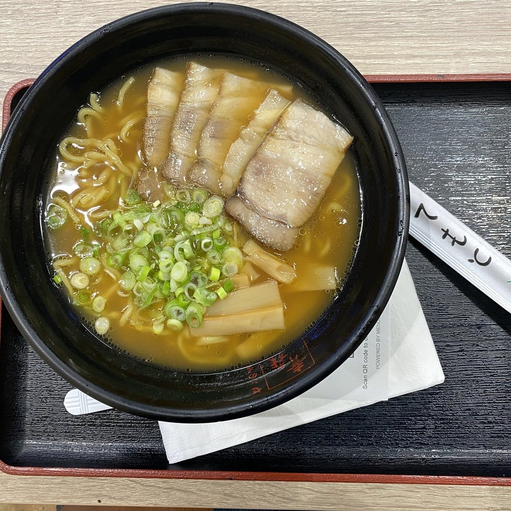 a bowl of ramen and chopsticks